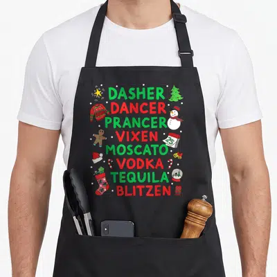 Prancer moscato apron - Stacked text Dasher Dancer Vixen Moscato Vodka Tequila Blitzen surrounded by snowman sweater — shown on a black cotton canvas apron against a white background