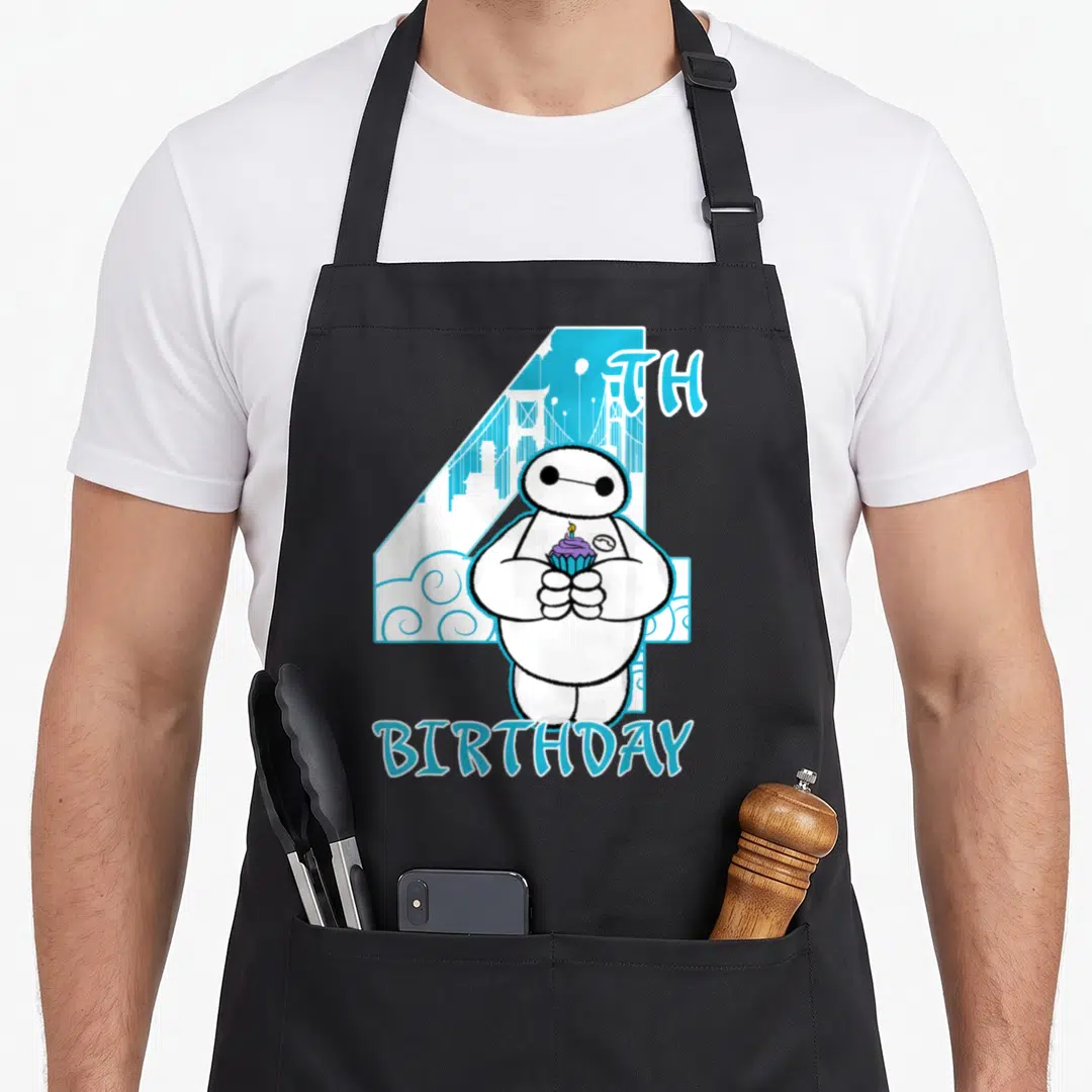 Hero cupcake apron - Baymax holding purple cupcake in front of blue number 4 with 4TH BIRTHDAY text — shown on a black cotton canvas apron against a white background