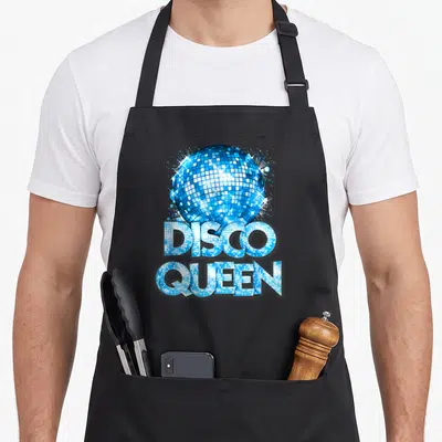 Seventy costume 70s apron - Blue disco ball above stacked DISCO QUEEN text filled with mirrored tile pattern — shown on a black cotton canvas apron against a white background