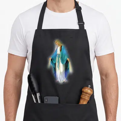 Mary mother's apron - Virgin Mary facing forward in blue and white robes with two front pockets — shown on a black cotton canvas apron against a white background