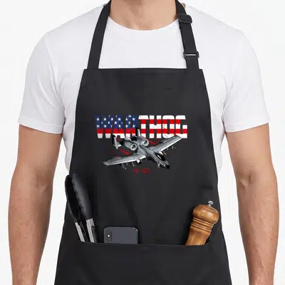 Military airplane apron - A-10 aircraft with WARTHOG American flag text and red A-10 label — shown on a black cotton canvas apron against a white background