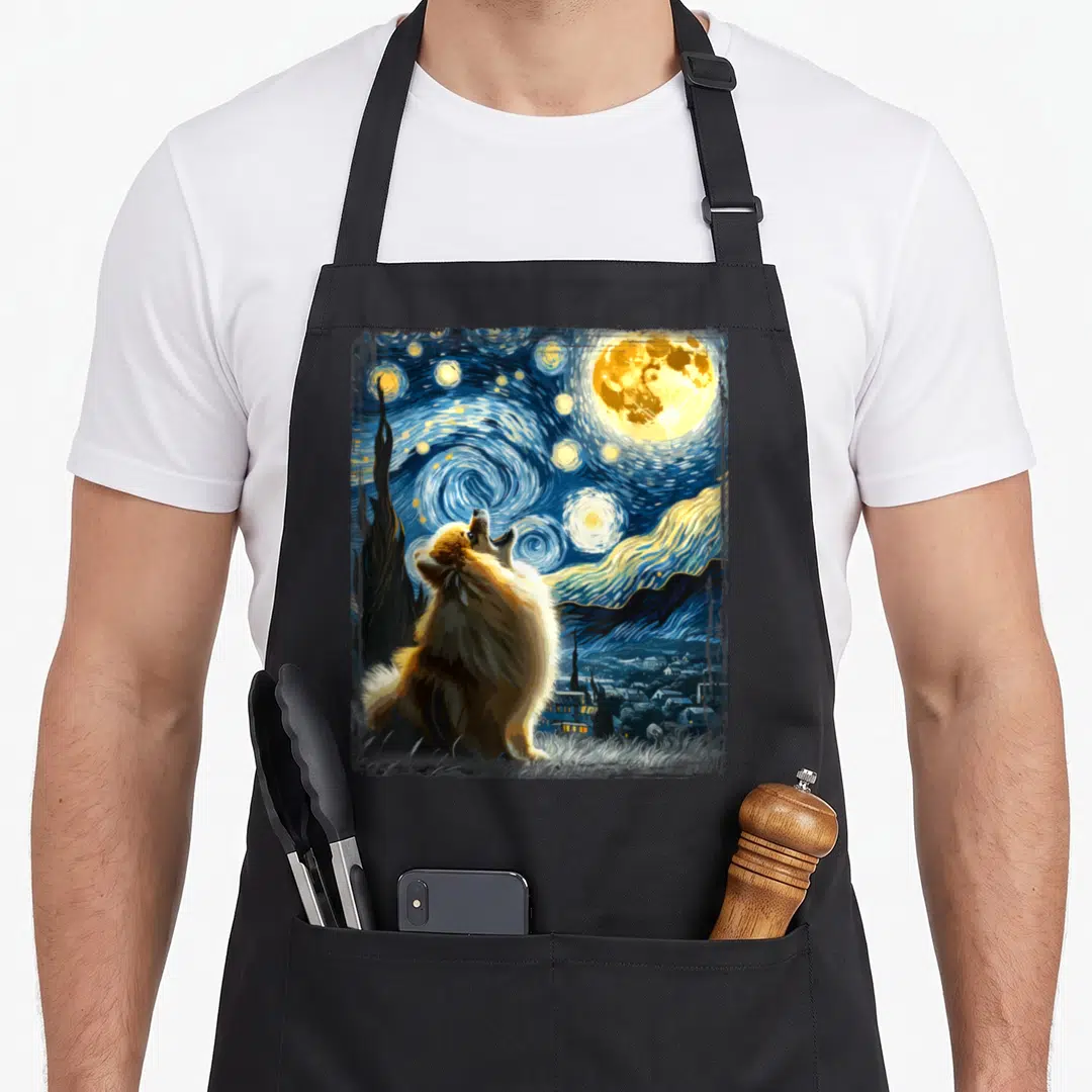 Pomeranian van gogh apron - Pomeranian dog under swirling blue starry night sky with yellow moon — shown on a black cotton canvas apron against a white background