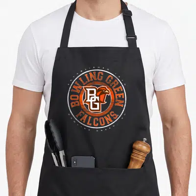 Bowling showtime falcon apron - Circular emblem with orange BG falcon logo and established 1910 text — shown on a black cotton canvas apron against a white background