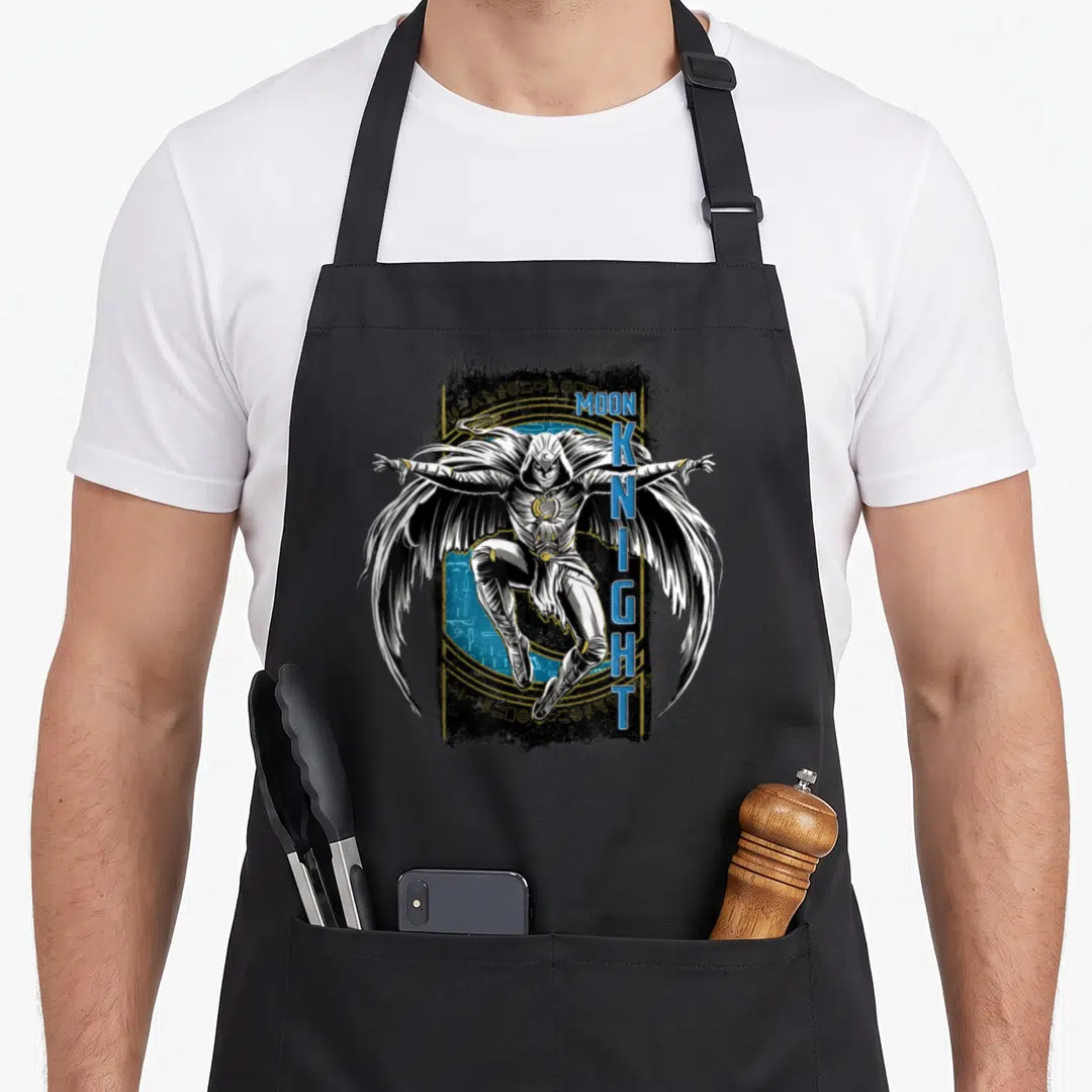 Hieroglyph egyptian apron - Moon Knight character in white costume with blue vertical text and gold hieroglyphic circle — shown on a black cotton canvas apron against a white background