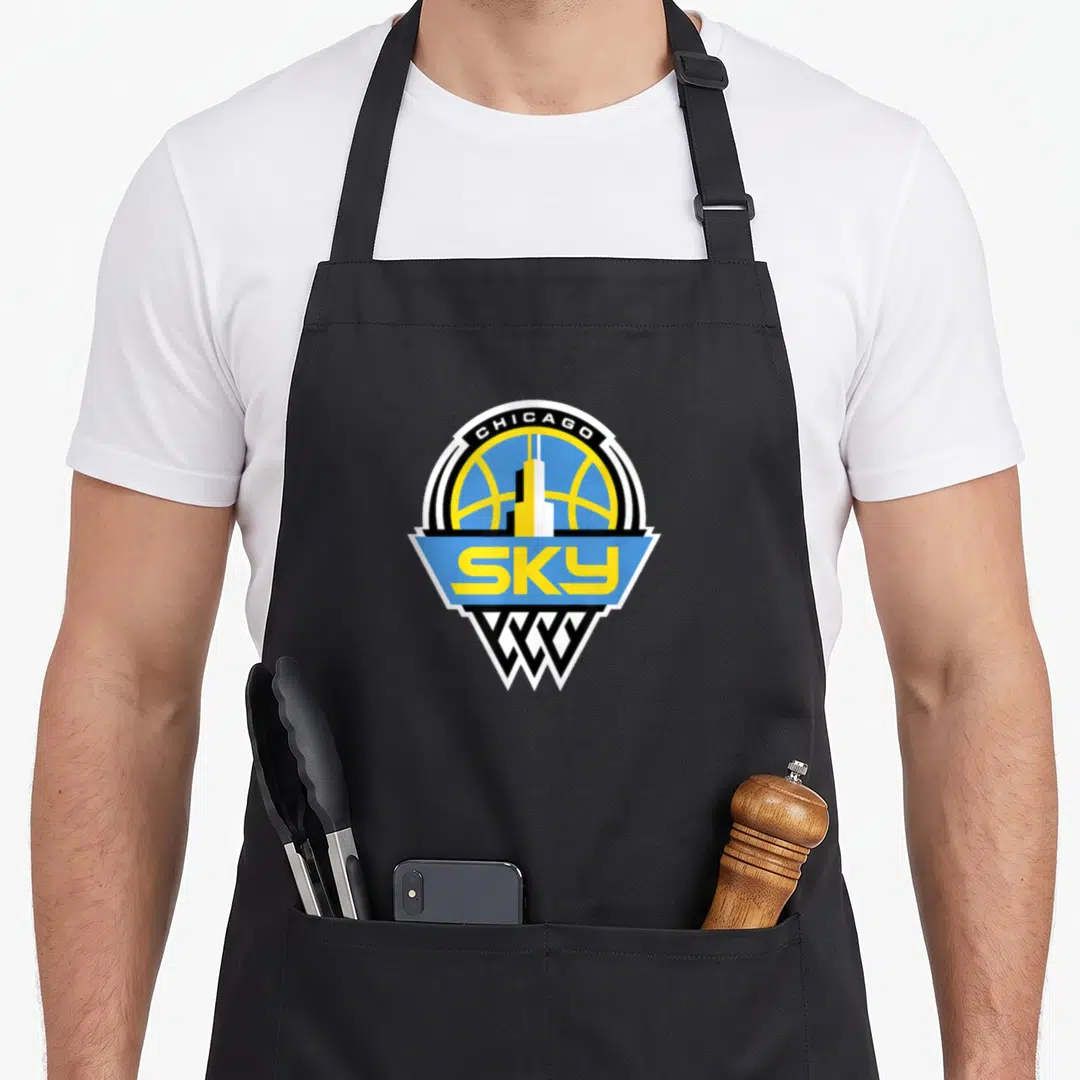 Wnba chicago apron - Shield logo with basketball, skyscraper, and SKY text in blue yellow white and black — shown on a black cotton canvas apron against a white background