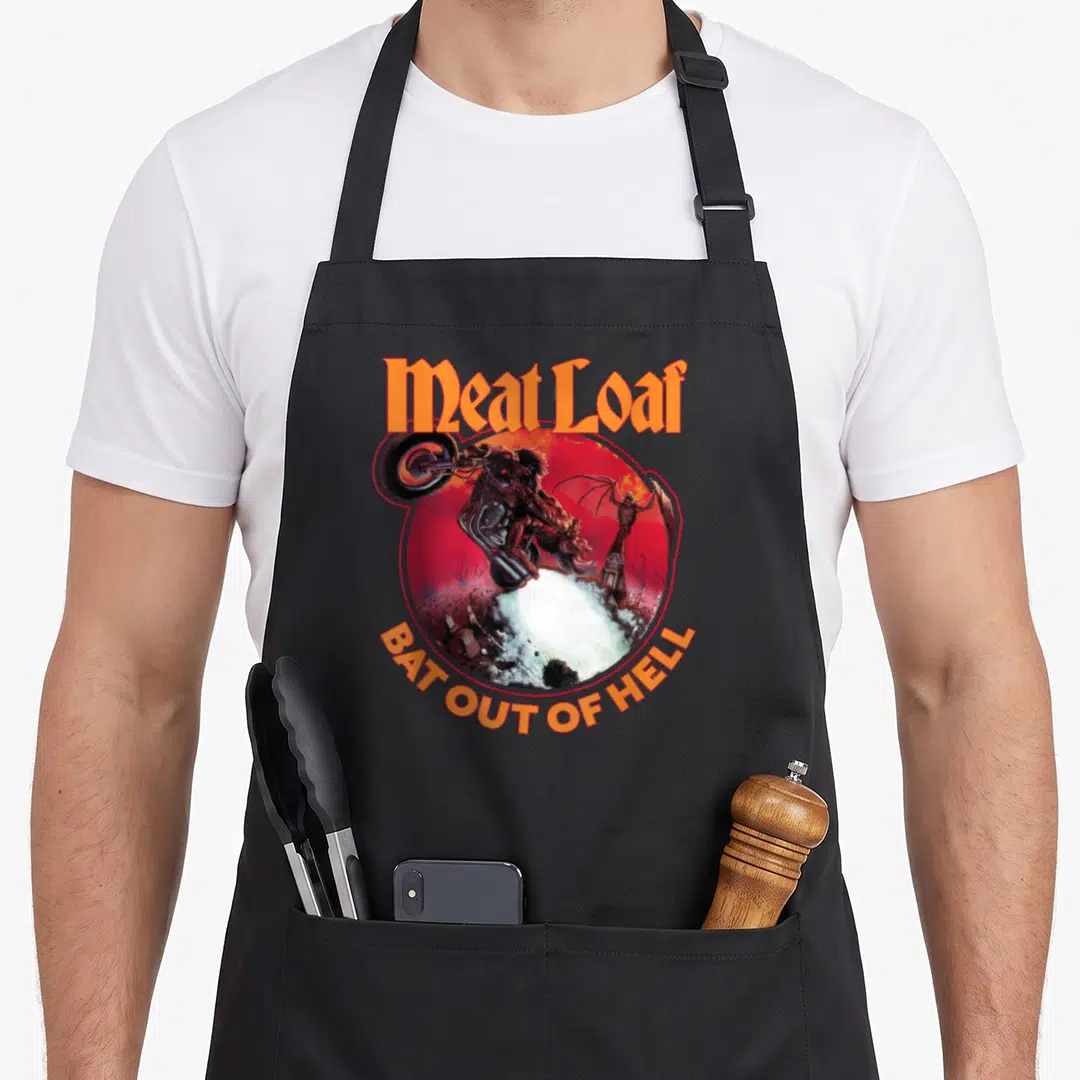 Loaf meat aprons - Meat Loaf text over circular motorcycle rider leaping from hell illustration in orange and red — shown on a black cotton canvas apron against a white background