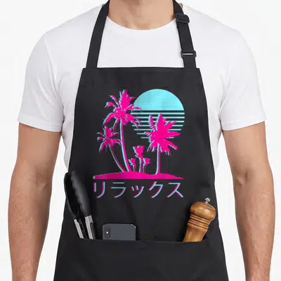 Vaporwave 1980s apron - Pink palm trees and blue striped sun with Japanese text on black apron — shown on a black cotton canvas apron against a white background