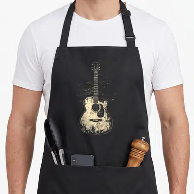 Rock acoustics apron - Beige distressed acoustic guitar illustration with splatter effects on canvas — shown on a black cotton canvas apron against a white background