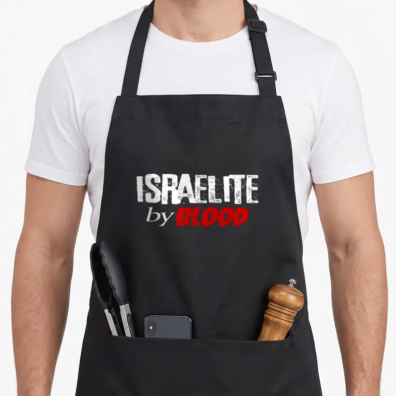 Hebrew blood apron - ISRAELITE by BLOOD text in white and red distressed font on black background — shown on a black cotton canvas apron against a white background