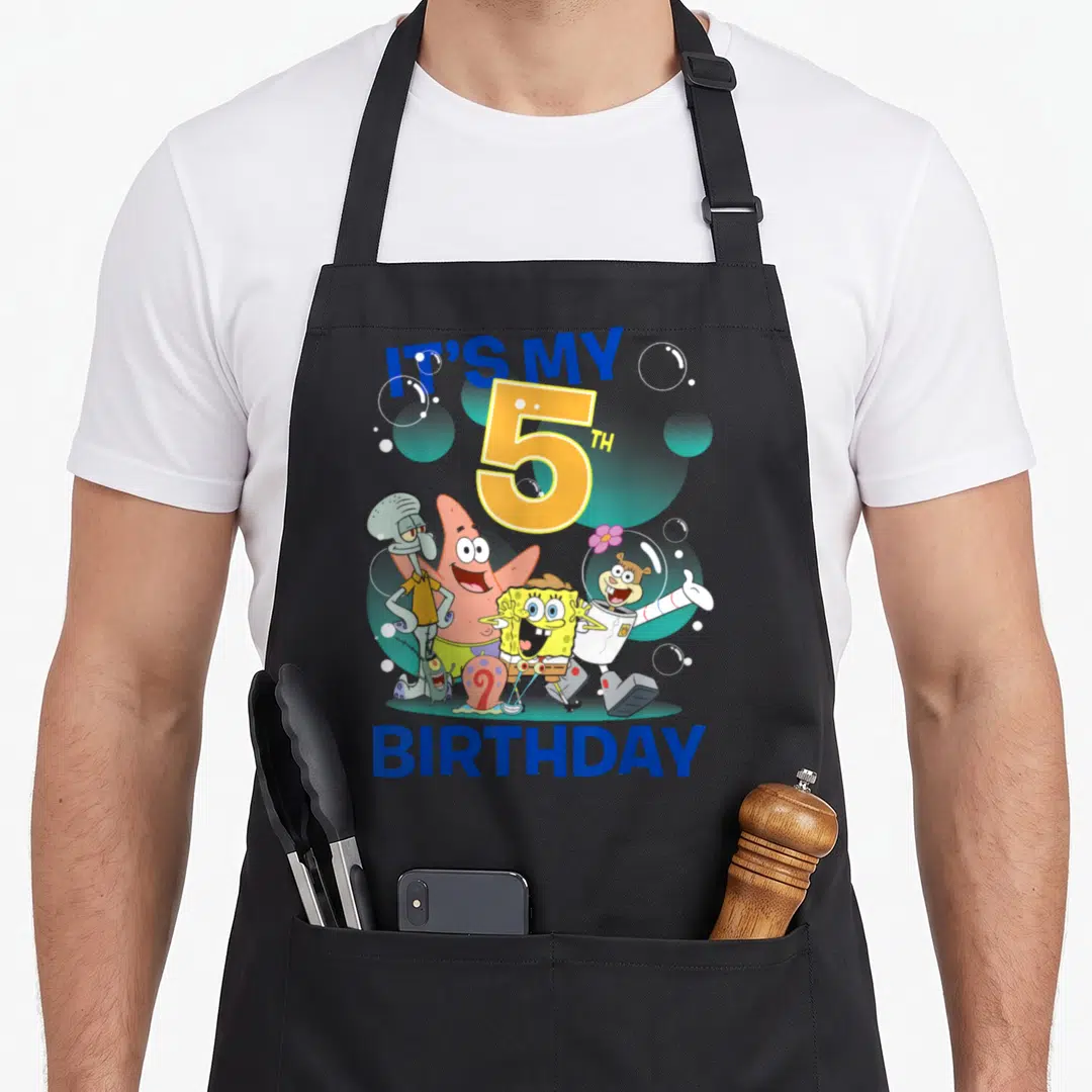 Squarepant 5th birthday apron - IT'S MY 5TH BIRTHDAY text with cartoon characters and bubbles — shown on a black cotton canvas apron against a white background