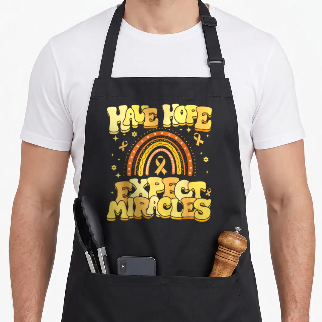 Hope infertility awareness apron - Retro rainbow with ribbons and text Have Hope Expect Miracles — shown on a black cotton canvas apron against a white background