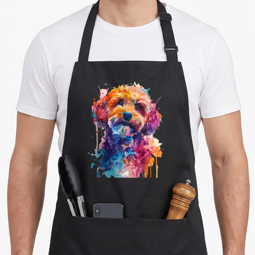 Pop colorful cockapoo apron - Multicolored watercolor portrait of a dog with orange pink blue purple yellow splatters — shown on a black cotton canvas apron against a white background