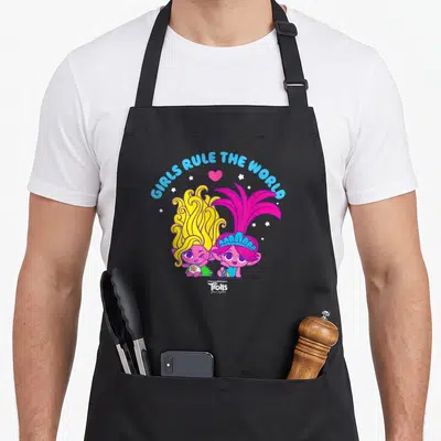 Together troll apron - GIRLS RULE THE WORLD text over two cartoon trolls with heart and stars — shown on a black cotton canvas apron against a white background