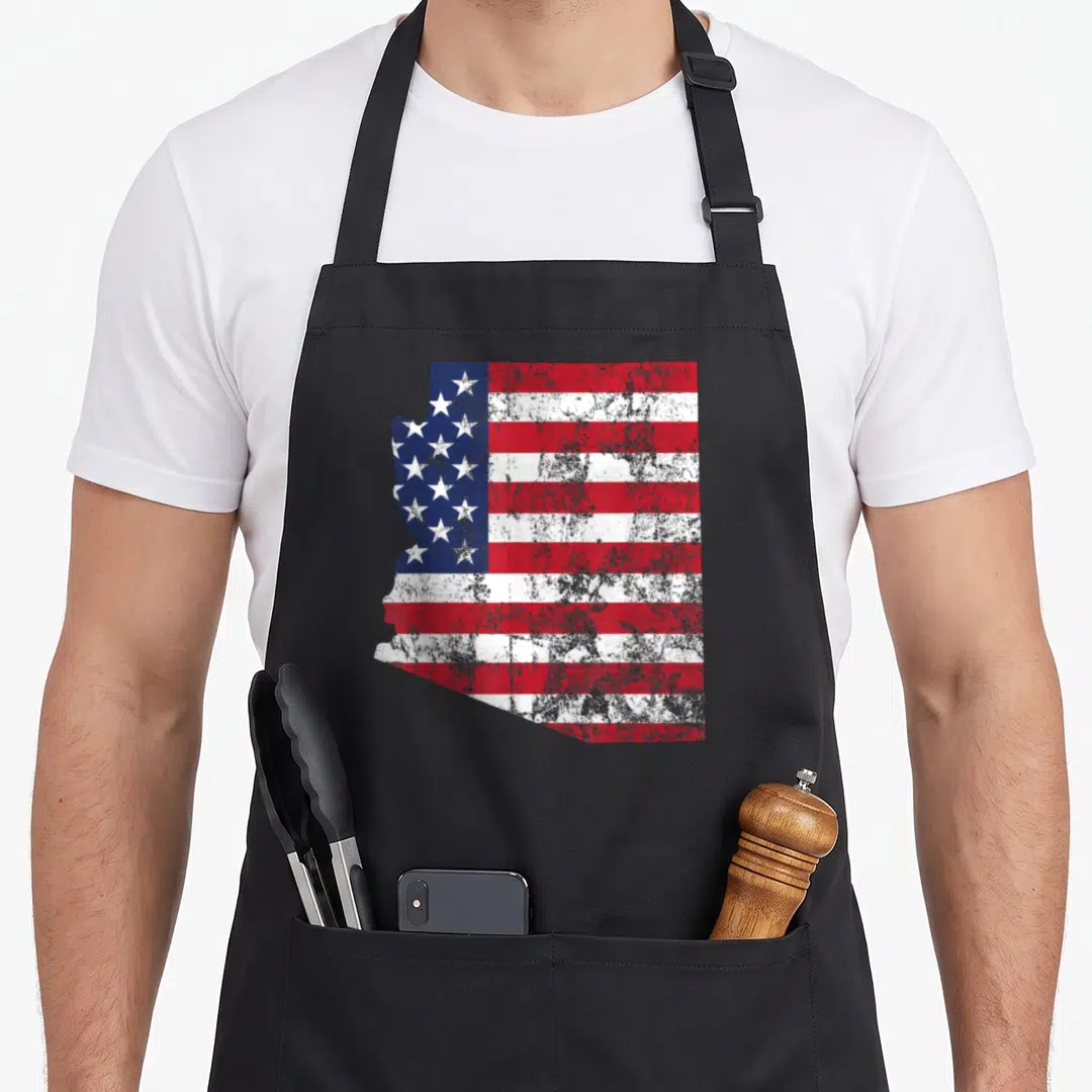 Arizona flag pride apron - Distressed Arizona state map silhouette filled with red white and blue US flag pattern — shown on a black cotton canvas apron against a white background