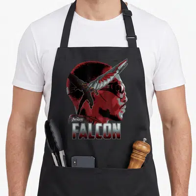 Infinity falcon apron - Red profile and full body Falcon figure with silver text on black apron — shown on a black cotton canvas apron against a white background