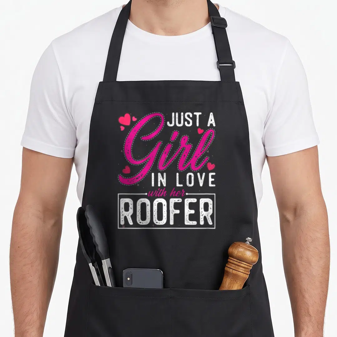 Roofer wife apron - Stacked text Just A Girl In Love With Her Roofer with small hearts — shown on a black cotton canvas apron against a white background