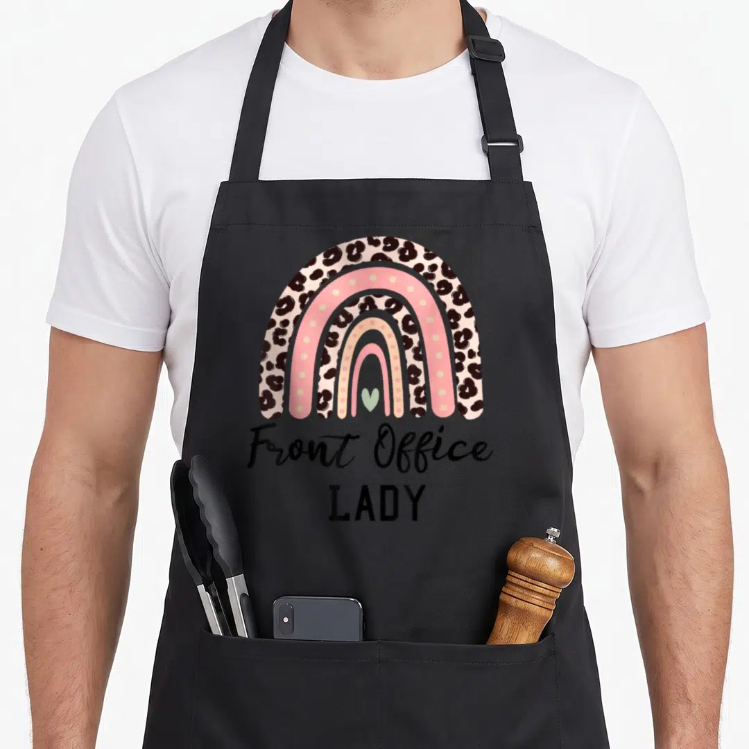Receptionist office apron - Leopard print rainbow with pink bands and Front Office LADY text — shown on a black cotton canvas apron against a white background