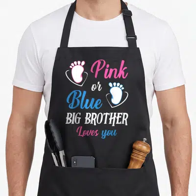 Blue brother apron or apron - Pink and blue baby footprints in hearts with big brother loves you text — shown on a black cotton canvas apron against a white background