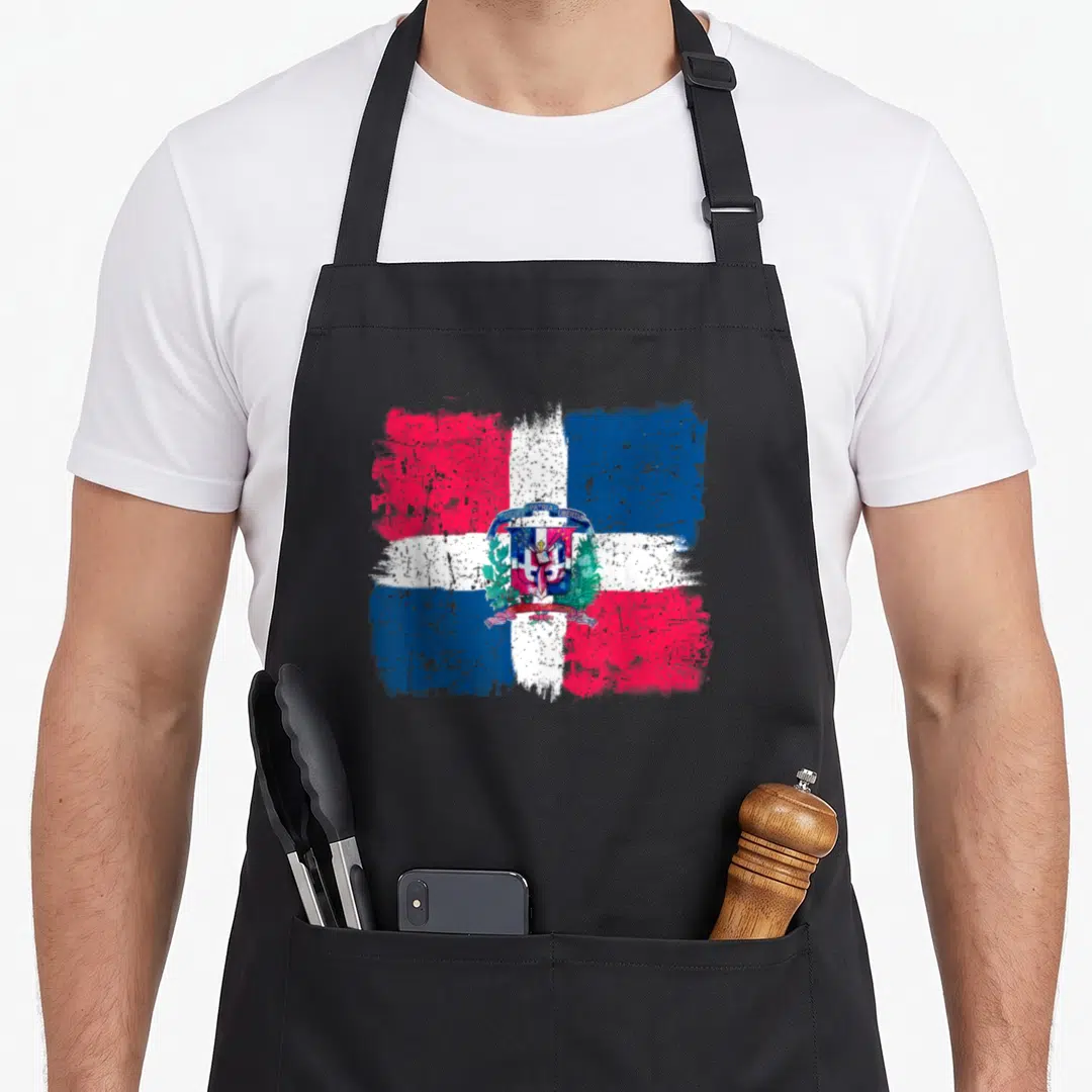Dominican the painted apron - Distressed Dominican flag with coat of arms and DIOS PATRIA LIBERTAD text in red white — shown on a black cotton canvas apron against a white background