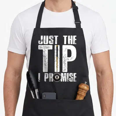 Pool cue billiards apron - JUST THE TIP I PROMISE text with pool cue replacing I and 8-ball inside O — shown on a black cotton canvas apron against a white background