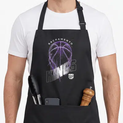 Lightning king apron - Purple basketball with white lightning bolts and Sacramento Kings text — shown on a black cotton canvas apron against a white background