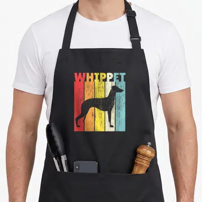 Cute whippet dog apron - Grey whippet silhouette standing before five vertical stripes in red orange yellow blue — shown on a black cotton canvas apron against a white background