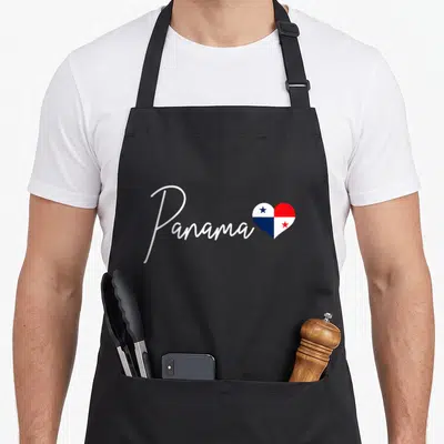 Panama panamanian pride apron - White script Panama text beside a heart filled with red white and blue flag quadrants — shown on a black cotton canvas apron against a white background