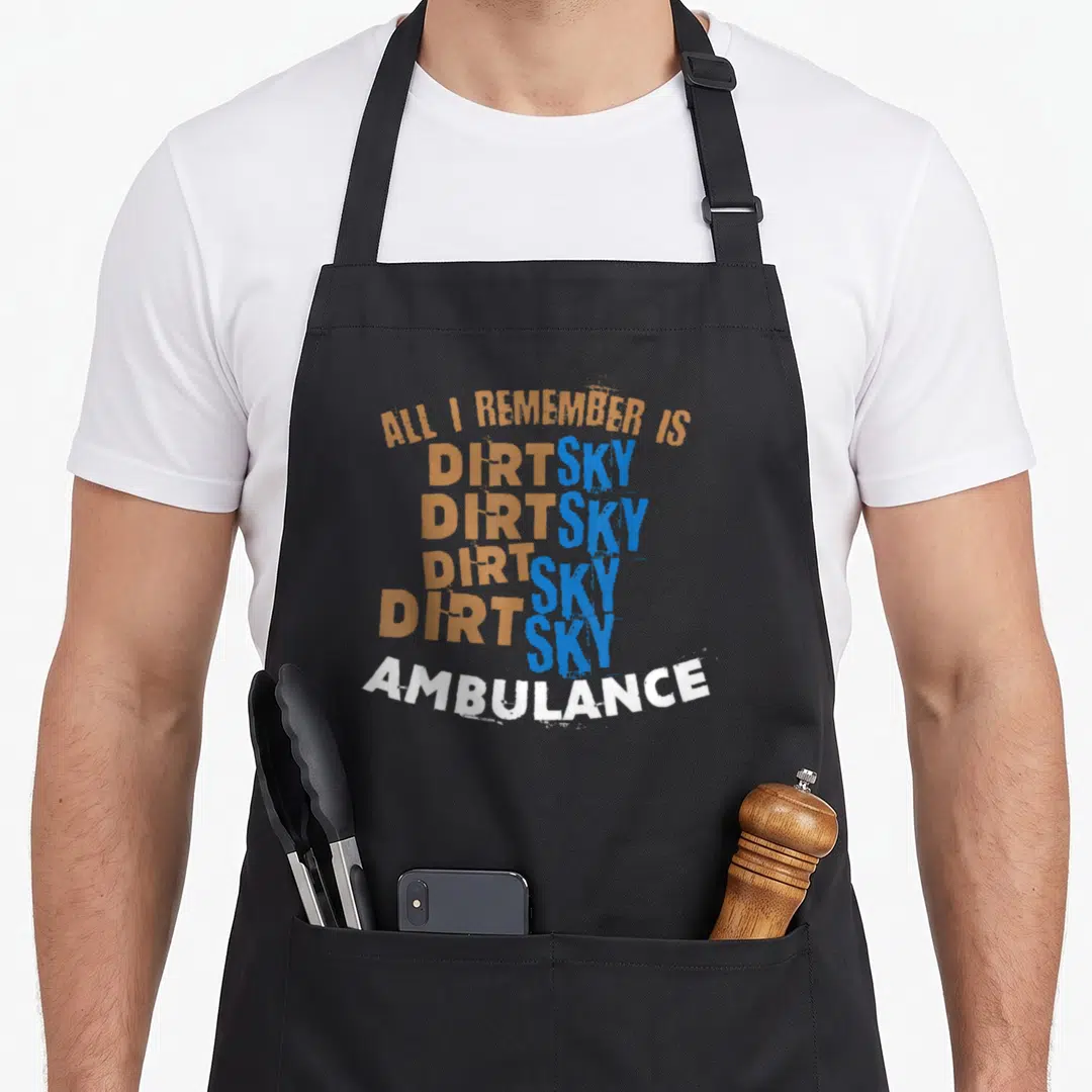 Motocross sky apron - Stacked orange blue and white text reading ALL I REMEMBER IS DIRT SKY AMBULANCE — shown on a black cotton canvas apron against a white background