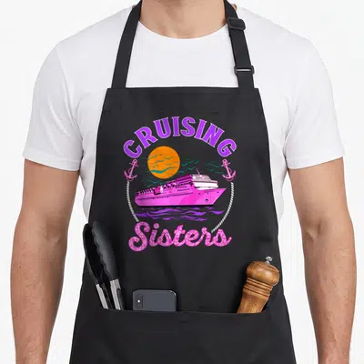 Sister cruising apron - Pink cruise ship under orange sun with anchors and Sisters text in rope circle — shown on a black cotton canvas apron against a white background