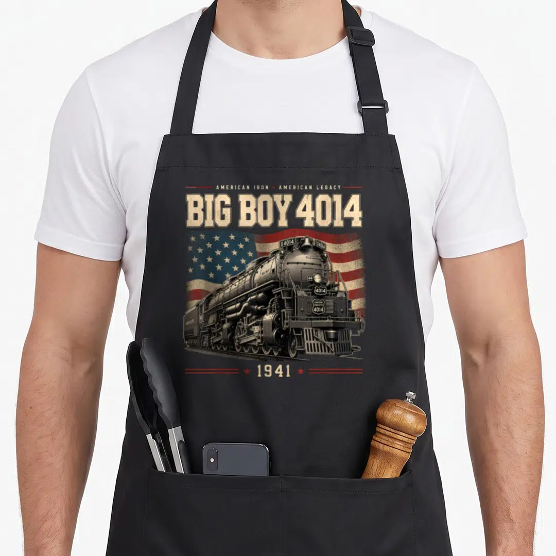 Cute train steam locomotive apron - Big Boy 4014 steam locomotive over a distressed American flag with 1941 text — shown on a black cotton canvas apron against a white background