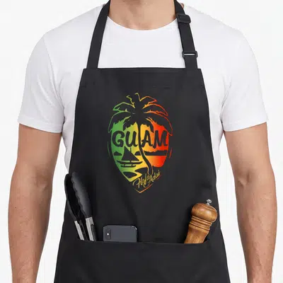 Flag guam aprons - Retro palm tree with GUAM text and Hafa Adai script in green yellow red — shown on a black cotton canvas apron against a white background
