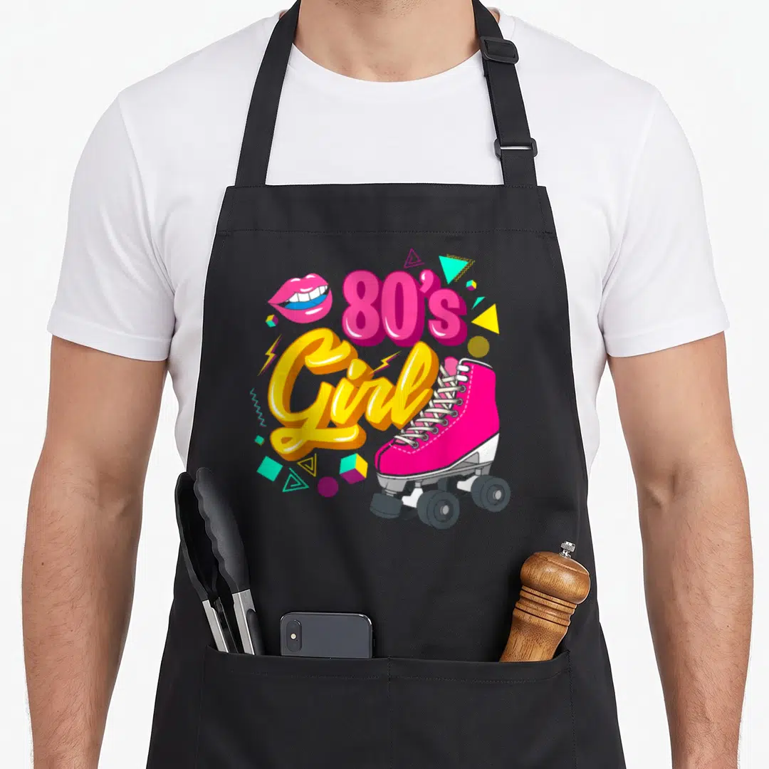80s chef outfit apron - Pink roller skate next to 80s Girl text with lips and geometric shapes in retro colors — shown on a black cotton canvas apron against a white background