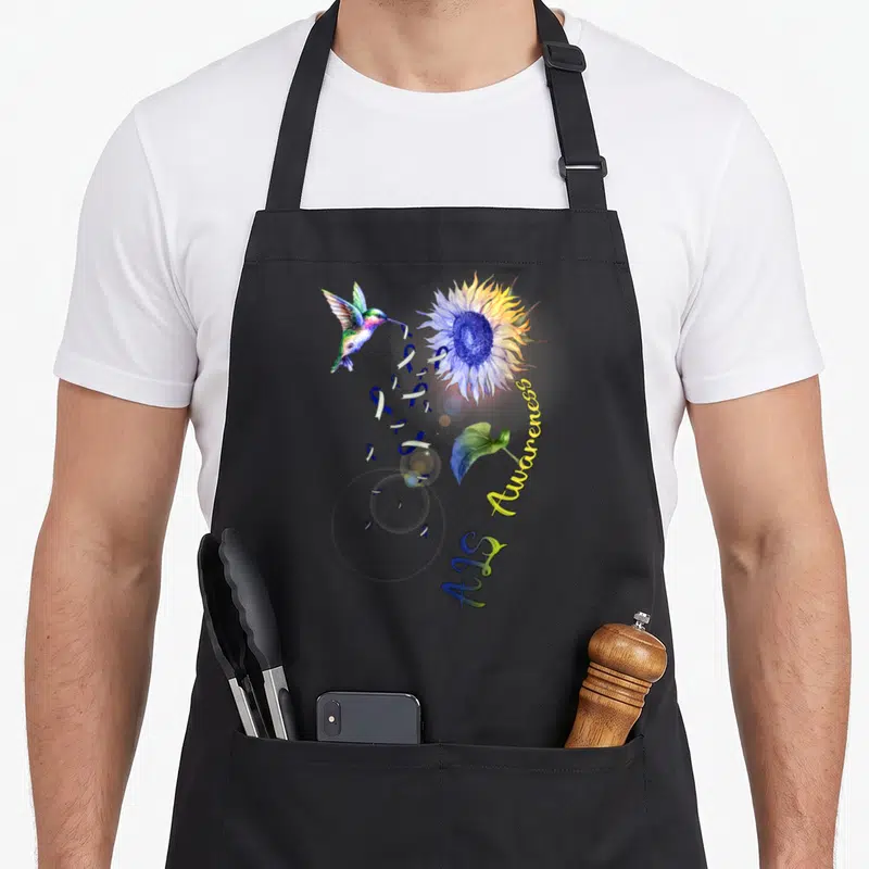 Als sunflower apron - Watercolor hummingbird, sunflower, blue ribbons, and Aids Awareness text in blue yellow and purple — shown on a black cotton canvas apron against a white background