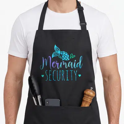 Mermaid security family aprons - Glittery blue mermaid tail with Mermaid SECURITY text and two cyan hearts — shown on a black cotton canvas apron against a white background