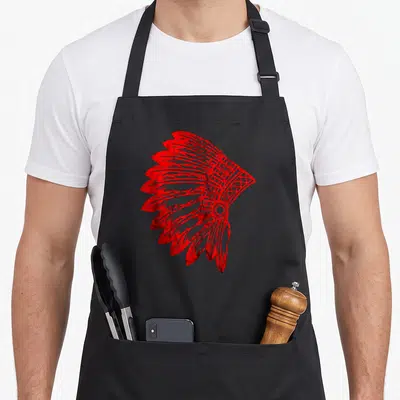 Skin fancy apron - Red line-art war bonnet with cross-hatched headband and fanned feathers centered on grey background — shown on a black cotton canvas apron against a white background