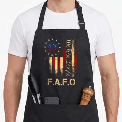 Fafo american flag apron - Distressed US flag with 47 in stars, vertical We The People text, and F.A.F.O at bottom — shown on a black cotton canvas apron against a white background