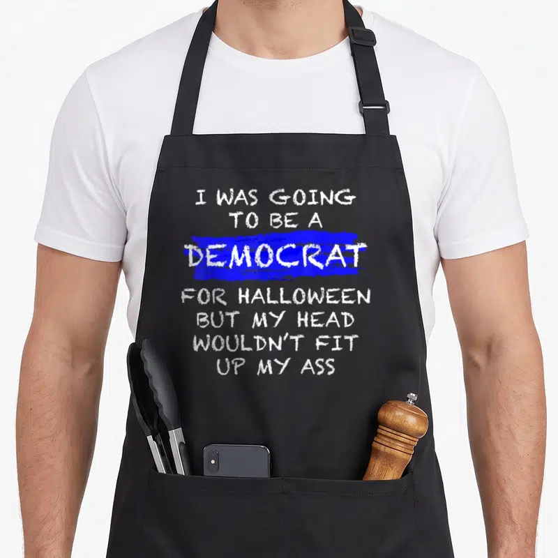 Anti halloween apron - White text stacked on blue stroke reading I was going to be a democrat for halloween but my head — shown on a black cotton canvas apron against a white background