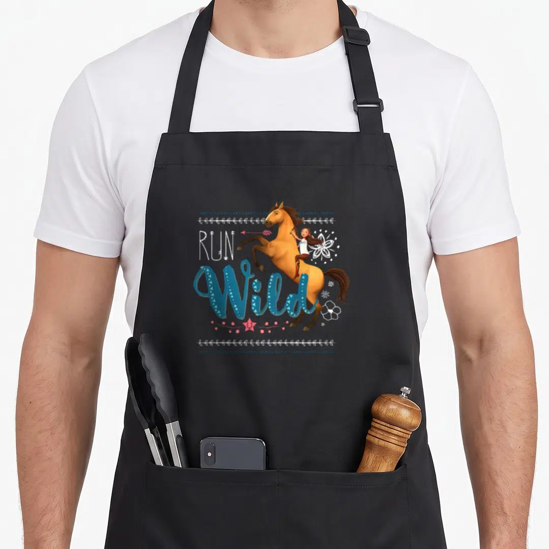Riding novelty apron - RUN Wild text with rearing brown horse, girl, and pink star decorations — shown on a black cotton canvas apron against a white background