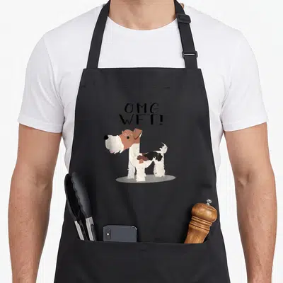 Omg fox aprons - Cartoon WFT dog with OMG WFT text on black bib apron — shown on a black cotton canvas apron against a white background