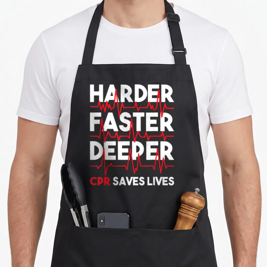 Harder ambulance apron - Stacked white text HARDER FASTER DEEPER overlaid with three red EKG lines and CPR SAVES LIVES — shown on a black cotton canvas apron against a white background