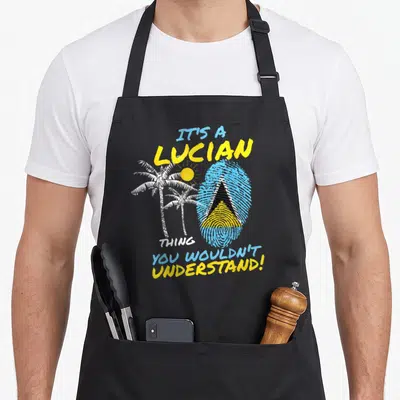 Independence saint lucia apron - Blue fingerprint with St Lucia flag, white palms, yellow sun, and text — shown on a black cotton canvas apron against a white background
