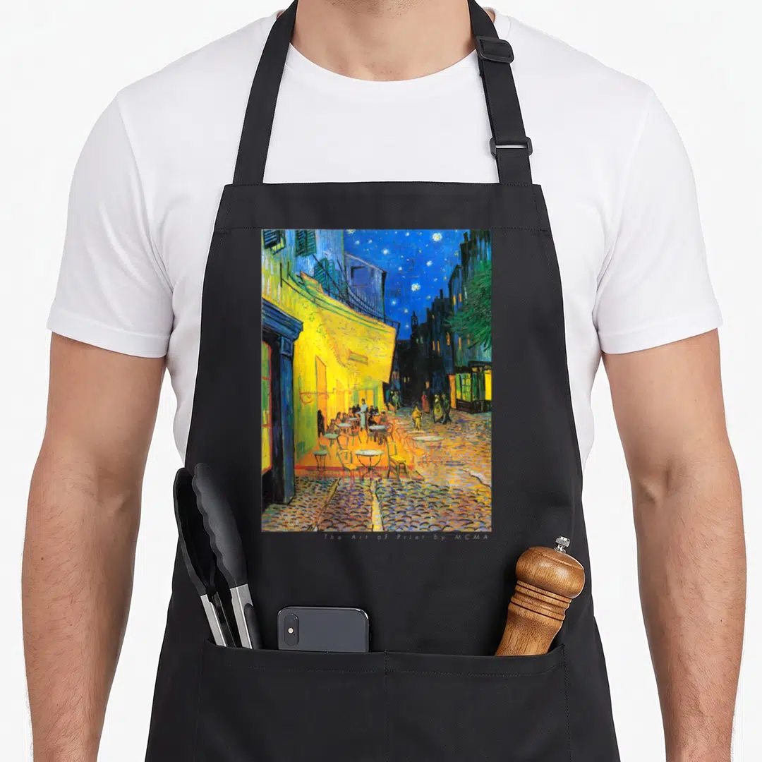 Cafe van gogh apron - Reproduction of the street cafe terrace at night painting in yellow and blue on black fabric — shown on a black cotton canvas apron against a white background
