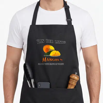 Van faith aprons - Retro mango illustration with stacked text Van Der Linde Mangoes Grown With Faith In Tahiti in black — shown on a black cotton canvas apron against a white background