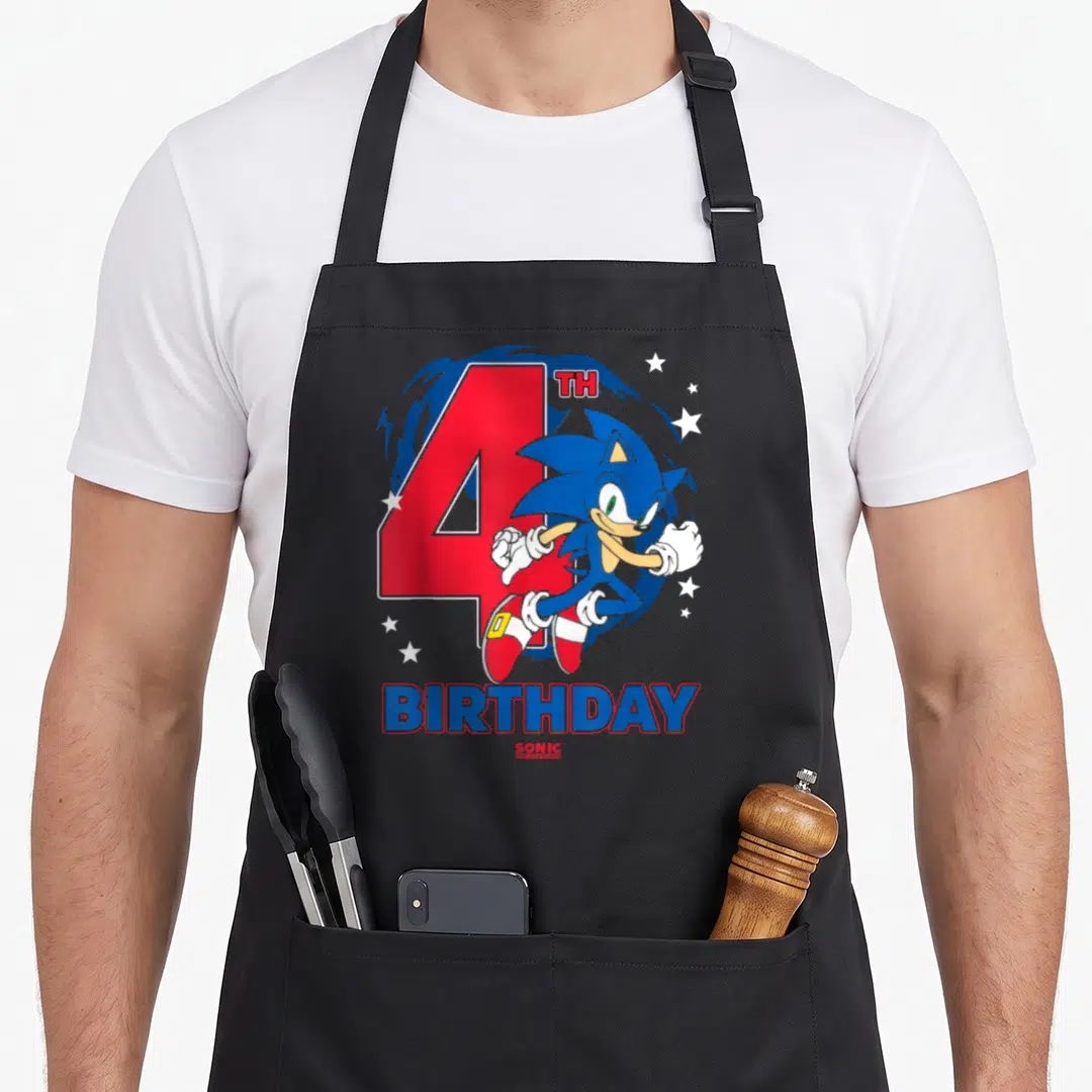 Chest birthday apron - Sonic the Hedgehog running in front of red number 4 and white stars with birthday text below — shown on a black cotton canvas apron against a white background