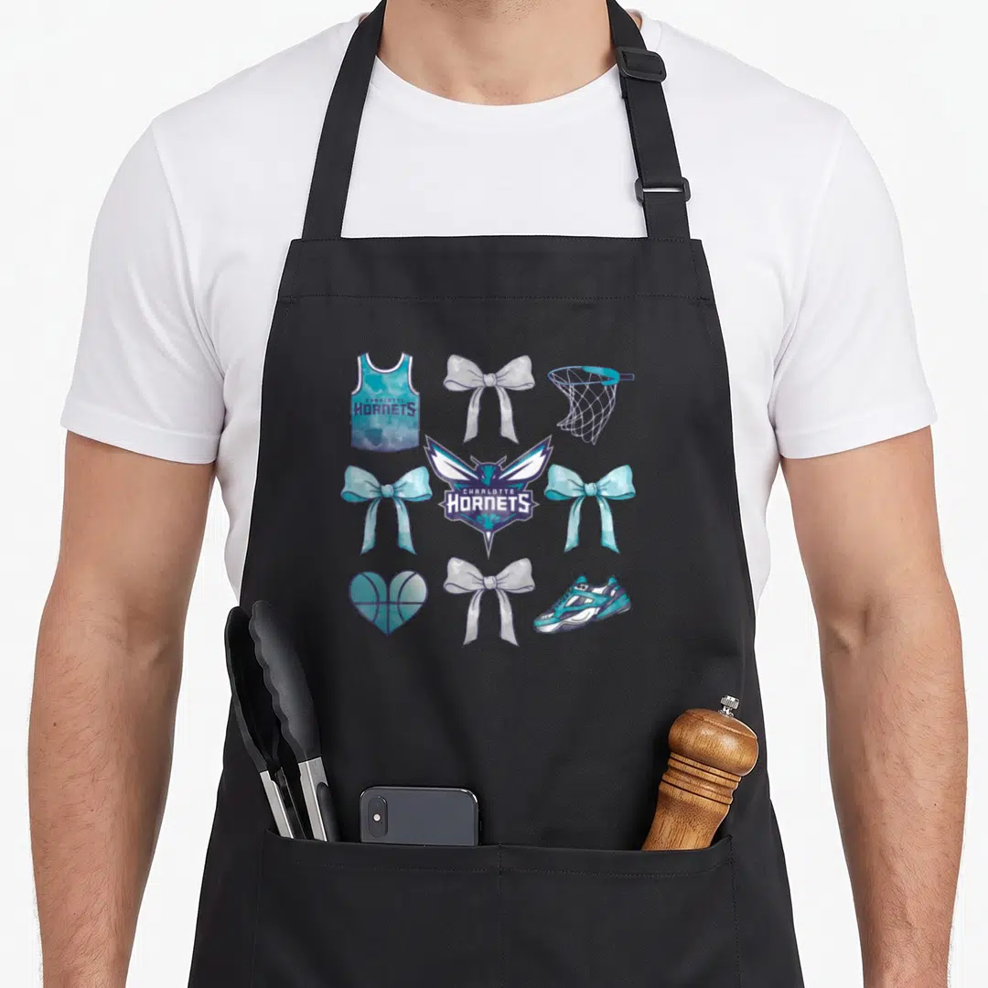 Charlotte bow apron - Charlotte Hornets logo surrounded by teal and purple bows, jersey, hoop, shoe, and heart — shown on a black cotton canvas apron against a white background