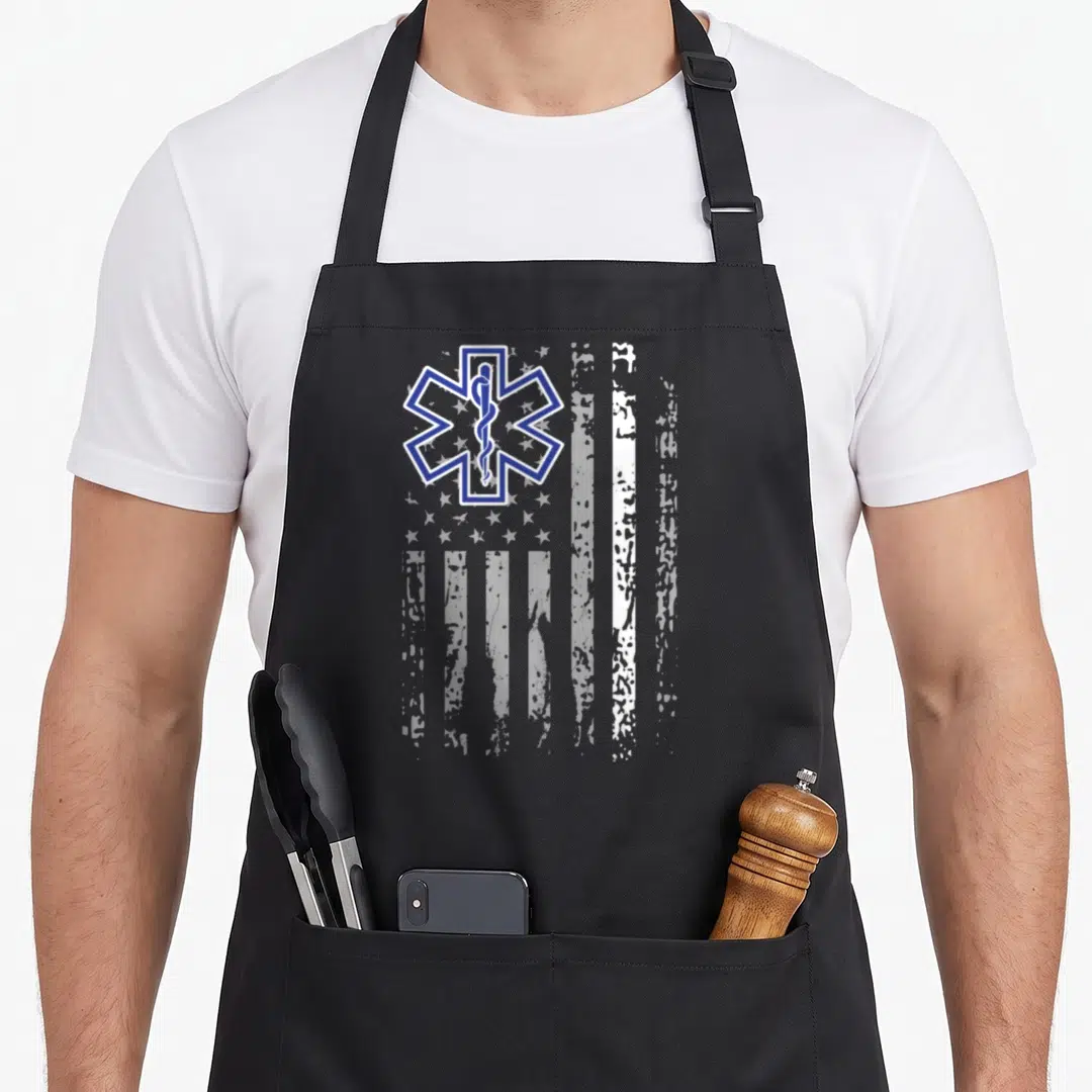 Ems american flag apron - Blue Star of Life symbol over distressed white vertical flag stripes — shown on a black cotton canvas apron against a white background