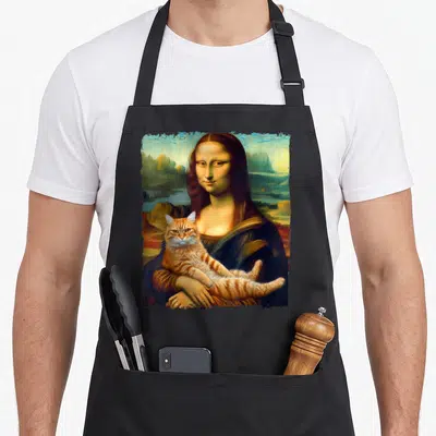 Lisa cat holding apron - Woman holding orange tabby cat in Renaissance portrait style with blue and green background — shown on a black cotton canvas apron against a white background