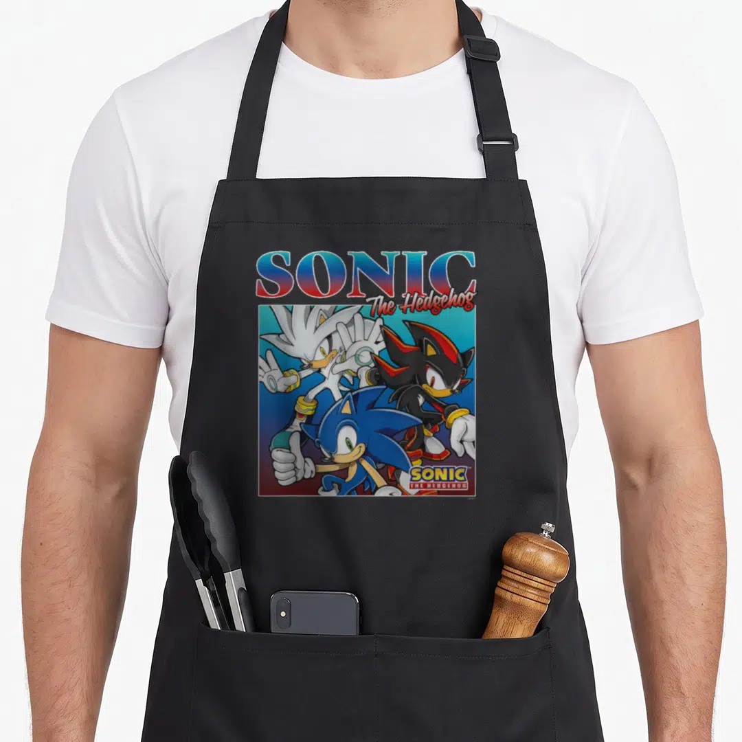 Shot crazy hedgehog man apron - Sonic thumbs up with Shadow and Silver under gradient title text — shown on a black cotton canvas apron against a white background