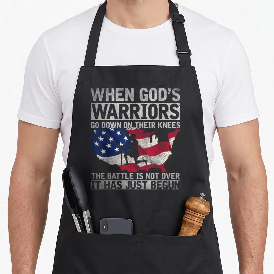 Devotee patriotic aprons - Kneeling soldier silhouette inside distressed US flag map with white and grey text — shown on a black cotton canvas apron against a white background