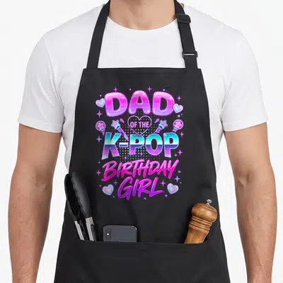 Birthday korean apron - Dad of the K-Pop Birthday Girl text with hearts microphones and stars in pink purple blue — shown on a black cotton canvas apron against a white background